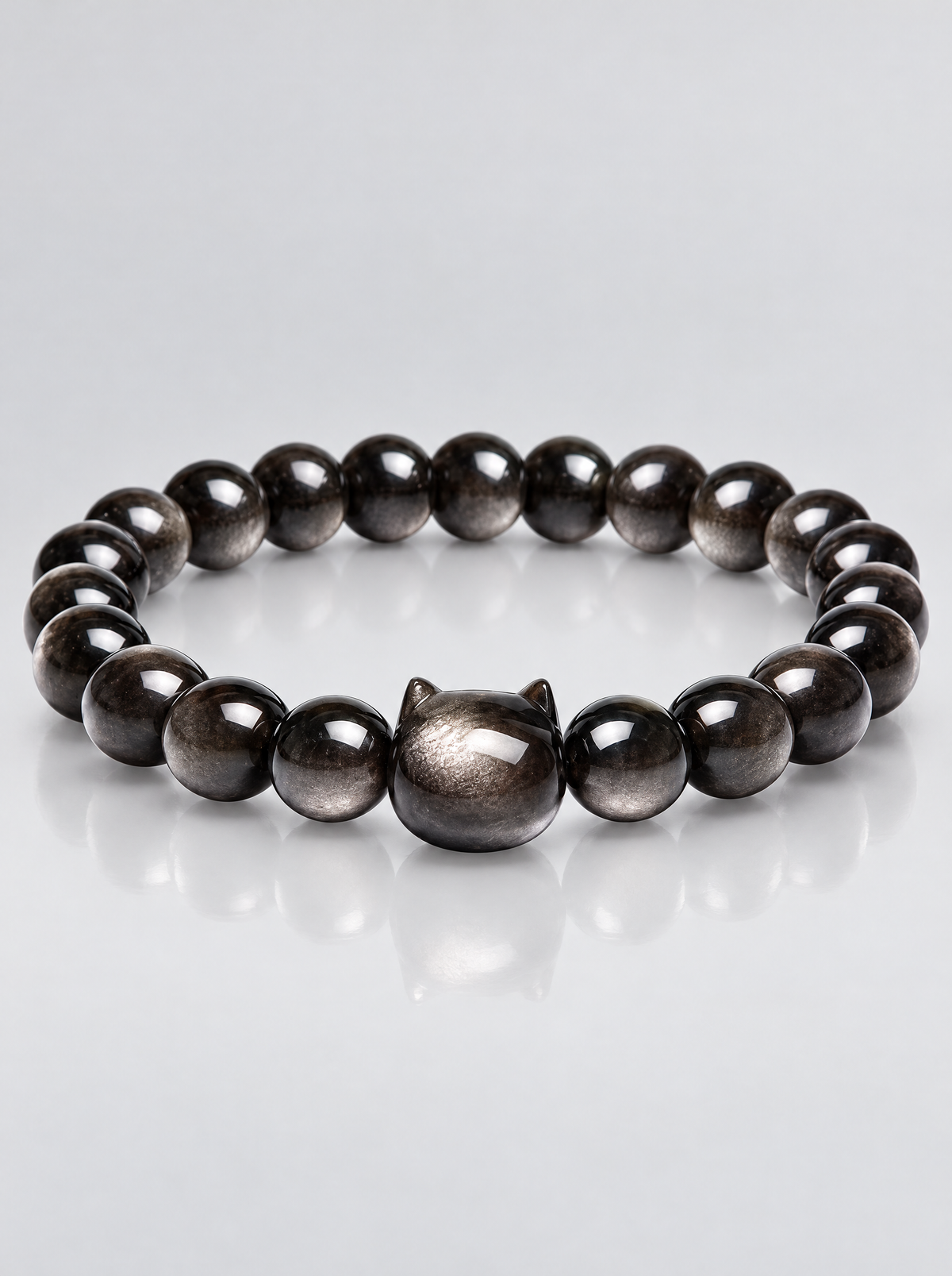 La Luna Obsidian Bracelet with silver-sheen obsidian beads and carved cat-head centrepiece